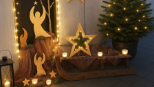 Christmas decorations with candles, stars, Christmas tree and angels in the outdoor area
