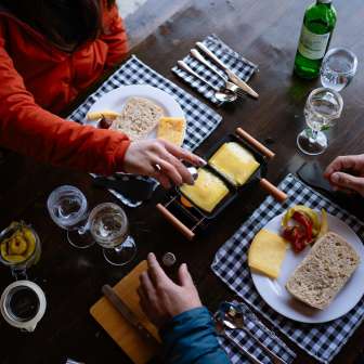 Eating raclette © Kevin Wildhaber