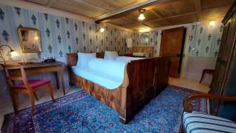Biedermeier room in the historic Hotel Alpenhof in Weisstannen