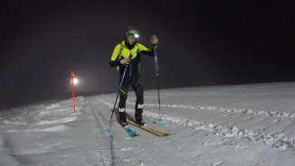 Night ski touring piste on the Pizol Ski tourers with headlamps on the night-time slopes on the Pizol