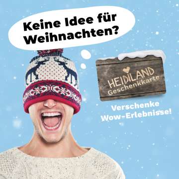 Man with knitted sweater and cap over his eyes in a cheerful mood