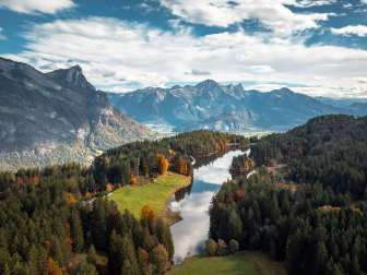 Lake Chapfensee photographed from above in the fall light. The mountains of the Bündner Herrschaft can be seen in the background